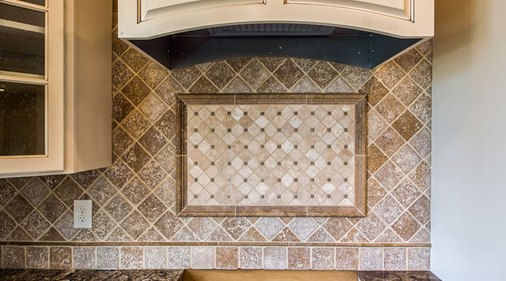 ICH Builders Linworth Worthington residence custom build close up of the backsplash tiling in the kitchen below the range hood