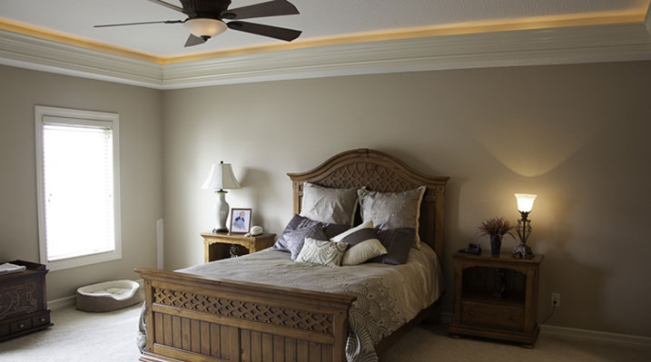 ICH Builders New Albany Ohio residence custom build bedroom with ceiling fan and crown molding