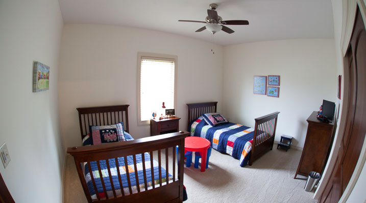 ICH Builders New Albany Ohio residence custom build finished bedroom with twin beds and ceiling fan