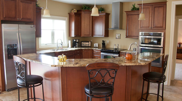 ICH Builders New Albany Ohio residence custom build kitchen showcasing the sit-up dining area and marble countertops