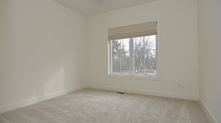 ICH Builders Dublin Ohio residence custom build bedroom with carpeted flooring