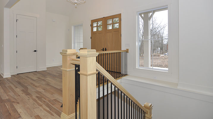 ICH Builders Dublin Ohio residence custom build front of house showing main entrance and stairs leading to basement