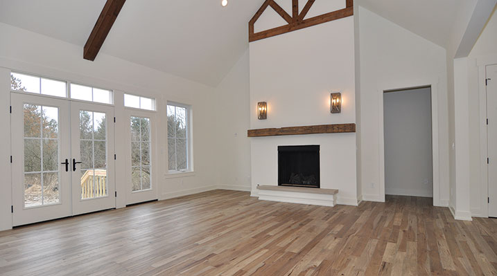 ICH Builders Dublin Ohio residence custom build rear first floor area with vaulted ceiling and fireplace