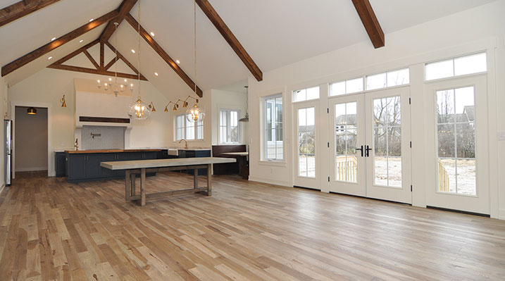 ICH Builders Dublin Ohio residence custom build main floor looking towards the rear French doors and open kitchen