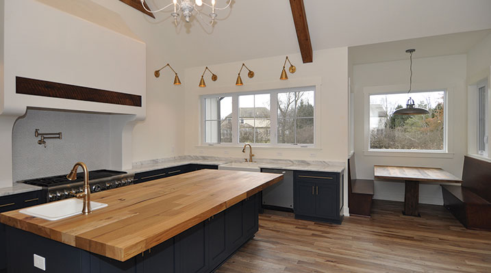 ICH Builders Dublin Ohio residence custom build kitchen area showing island, sinks, and breakfast nook