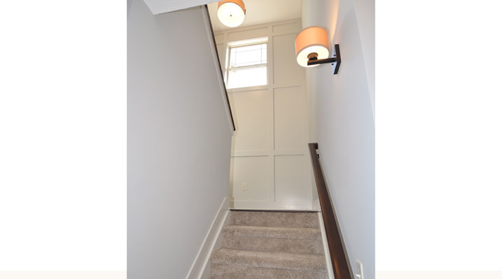 ICH Builders Berlin Ohio residence custom build view looking up the stairs towards Batten Grid wall