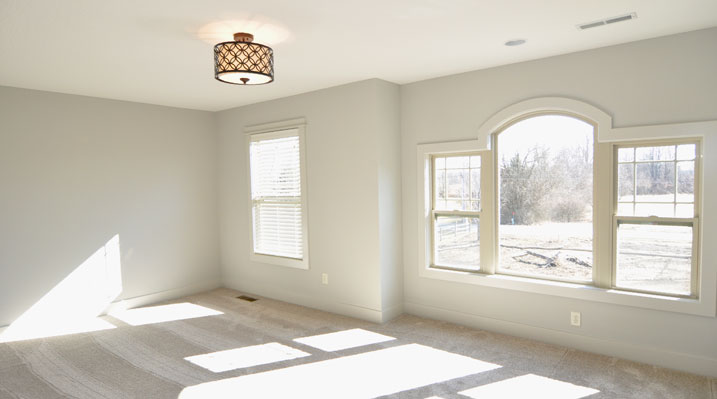 ICH Builders Berlin Ohio residence custom build bedroom with a Palladian window, a classic three-part design consisting of a large, arched central section flanked by two narrower, shorter rectangular windows