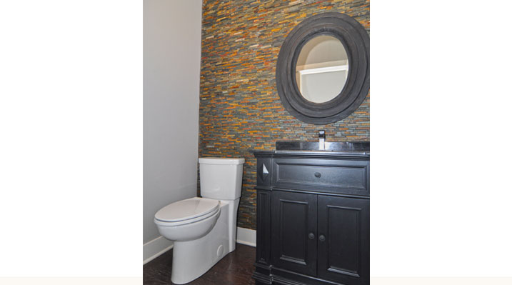 ICH Builders Berlin Ohio residence custom build half bathroom with circular mirror