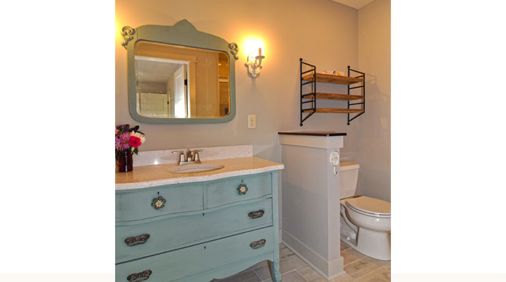 ICH Builders Berlin Ohio residence custom build bathroom with vintage-style blue painted vanity and mirror