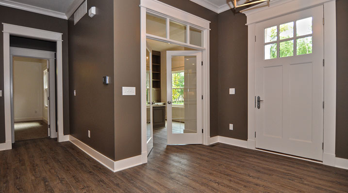 ICH Lithopolis Ohio residence custom build view from the main living areas showing wooden floors and large white main entrance door