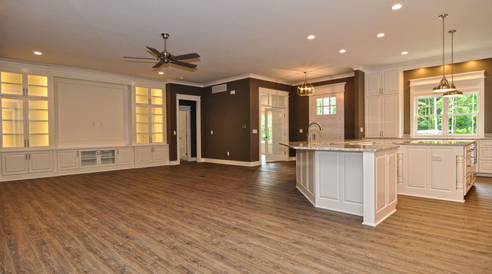 ICH Lithopolis Ohio residence custom build a view of the main living area showing ceiling fan, wooden floors and open kithcen area