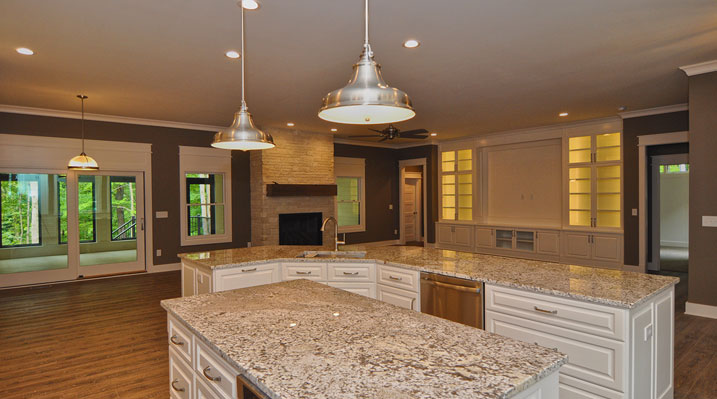 ICH Lithopolis Ohio residence custom build another view of the open kitchen featuring an island and a sit-down bar counter with Giallo Ornamental or Santa Cecilia Gold granite countertops