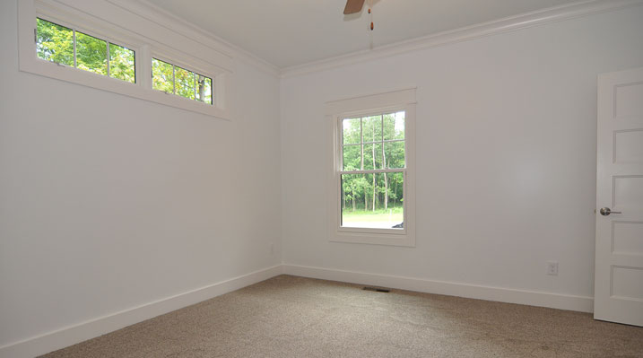 Iulianelli Custom Homes Lithopolis Ohio residence custom build showing room with white walls and basement slider windows