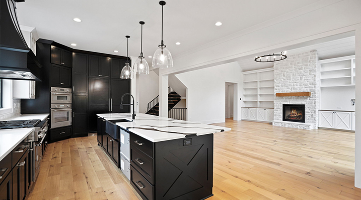ICH Builders Canal Winchester Ohio residence custom build view of kitchen with main living area and main stairs in background