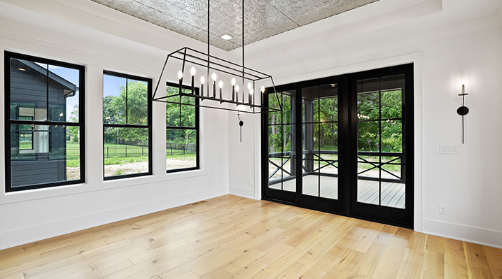 ICH Builders Canal Winchester Ohio residence custom build dining area looking towards the black-framed sliding French patio doors