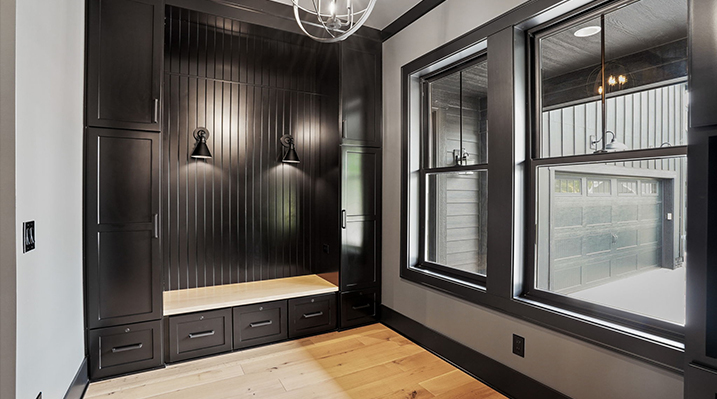 ICH Builders Canal Winchester Ohio residence custom build modern black metal wall sconces mounted above a bench
