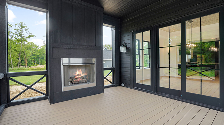 ICH Builders Canal Winchester Ohio residence custom build enclosed patio with black walls and fireplace