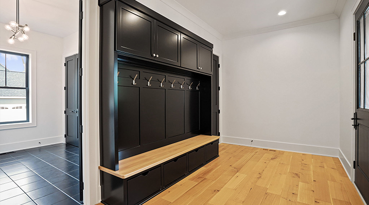 ICH Builders Canal Winchester Ohio residence custom build mudroom with black cabinets and silver fixtures