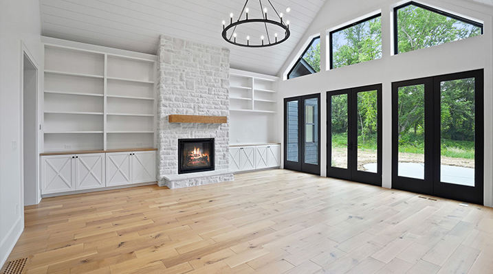 ICH Builders Canal Winchester Ohio residence custom build main room with fireplace and wooden floors