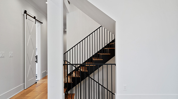 ICH Builders Canal Winchester Ohio residence custom build stairs with black iron railings