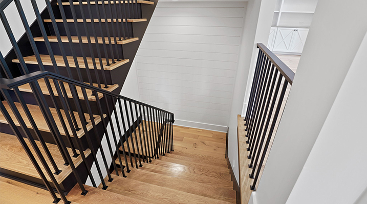 ICH Builders Canal Winchester Ohio residence custom build another view of the wooden stairs with black railings