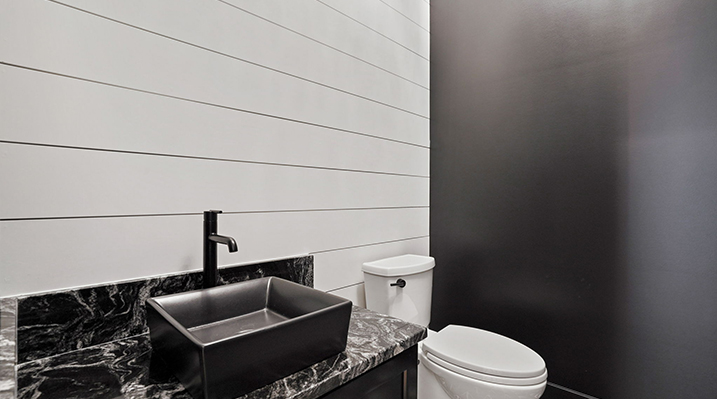 ICH Builders Canal Winchester Ohio residence custom build bathroom with matte black, rectangular sink on black vanity