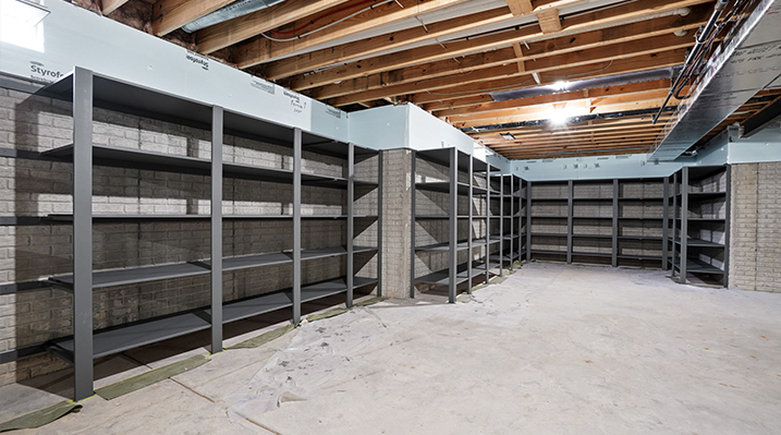 ICH Builders Canal Winchester Ohio residence custom build view of the unfinished basement area with gray industrial shelving
