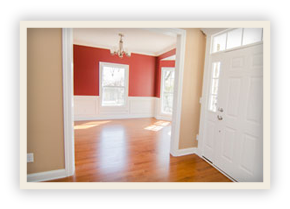 thumbnail image of Iulianelli Custom Homes Oakland Model showing front entrance area with white wooden front door and white paneling covering the bottom of dark red walls 