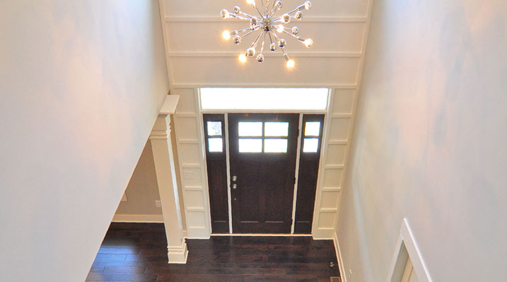 Iulianelli Custom Homes London Model A looking down the main stairs from second floor to the front door