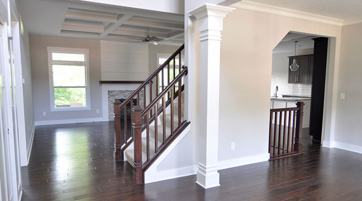 Iulianelli Custom Homes London Model A showing stairs leading up to second floor and surrounding first floor