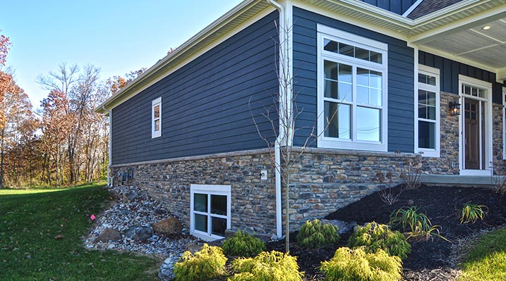 Iulianelli Custom Homes Madison Model outside corner view showing basement window