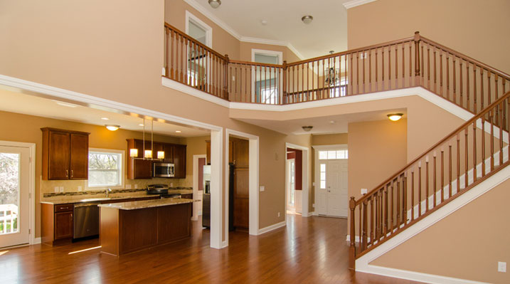 Iulianelli Custom Homes Oakland Model interior showing kitchen and staircase before finished painting