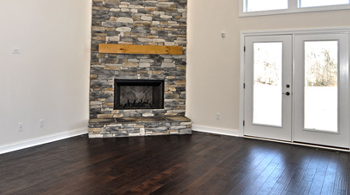 slider image of Oakland Model showing fireplace and rear doors