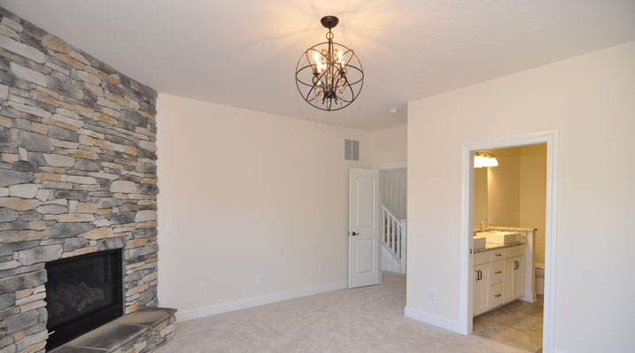 Iulianelli Custom Homes Oakland Model upstairs bedroom and fireplace