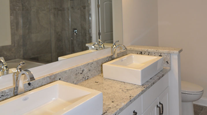 slider image of Oakland Model double sink vanity in bathroom