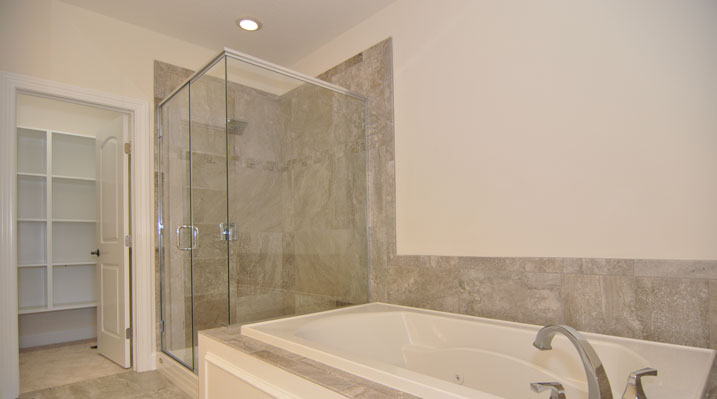 Iulianelli Custom Homes Oakland Model bathtub and separate glass inclosed stand alone shower
