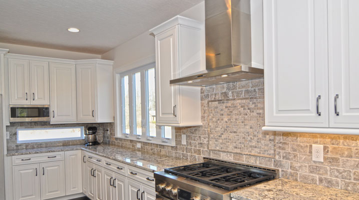 Iulianelli Custom Homes Oakland Model kitchen showing backsplash, cabinets and counter tops