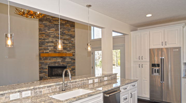 Iulianelli Custom Homes Oakland Model view from open kitchen area looking towards rear doors
